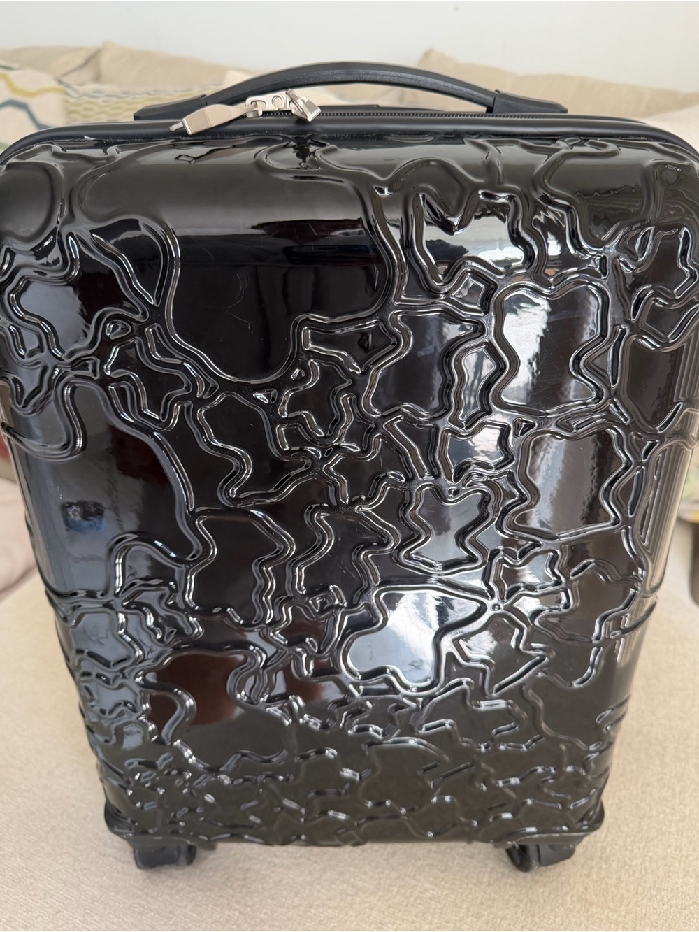 Glossy Black Tous Textured Hard-Shell Carry-On luggage